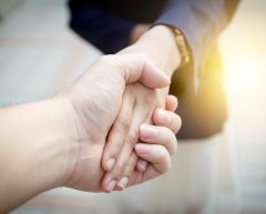 couple holding hands.
