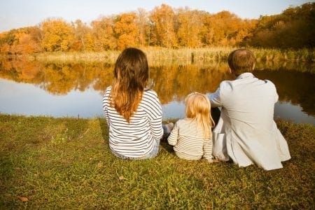 children sat with parents by the river for the artcile Arbitration in family law – a private judge to settle disputes about your