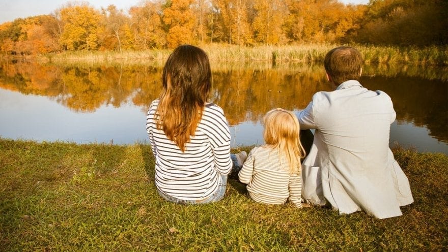 children sat with parents by the river for the artcile Arbitration in family law – a private judge to settle disputes about your