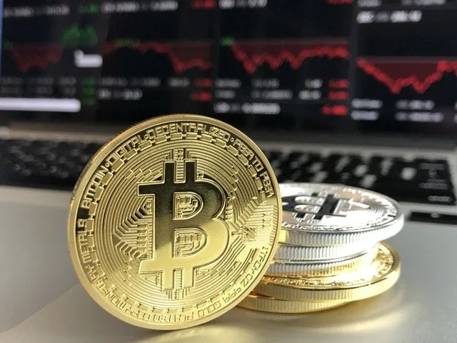 bitcoins hidden in divorce stacked in front of computer