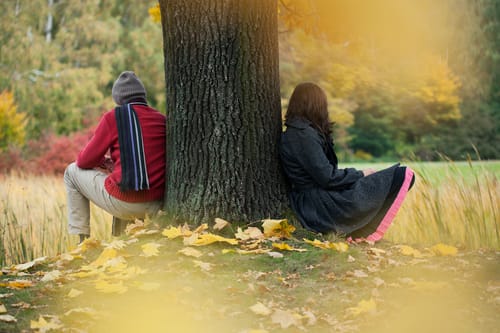 Couple next to tree